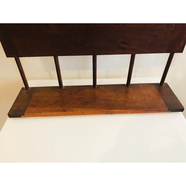 Outstanding vintage American walnut mirror with doweled hanging shelf underneath. Perfect for the bedroom, entry or any...