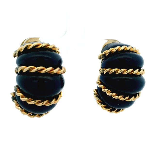 A captivating expression of 1960s glamour, these sculptural estate earrings pair richly saturated blue agate with warm 14...