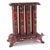 An extraordinary antique Superior four-tube gas parlor heater featuring elaborate Victorian-inspired metalwork, a rich...