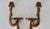 Pair of vintage Mid-Century Florentine-style ribbon and bow wall shelf sconces, featuring gold-painted resin construction...