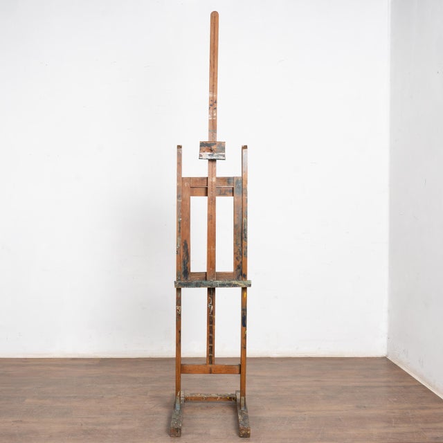 Late 19th Century Antique Wood Painter's Easel This vintage artist's easel rests solidly on its wood base. It reveals...
