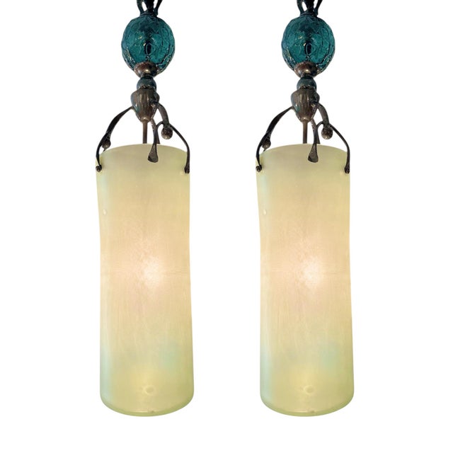 Bold and artistic, this striking pair of 1980s Brutalist chandeliers features hand-blown frosted glass cylinders suspended...