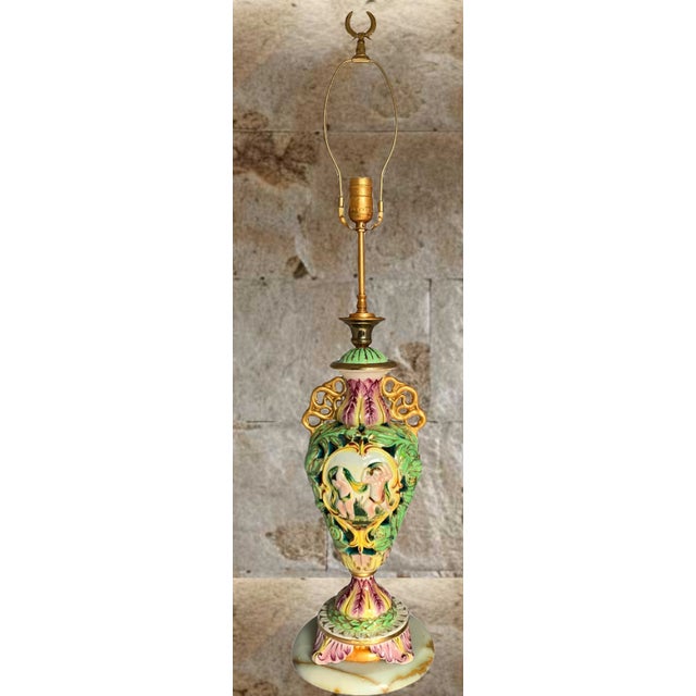This Mid-century Capodimonte reticulated porcelain piece showcases exquisite Italian craftsmanship. The curved body...
