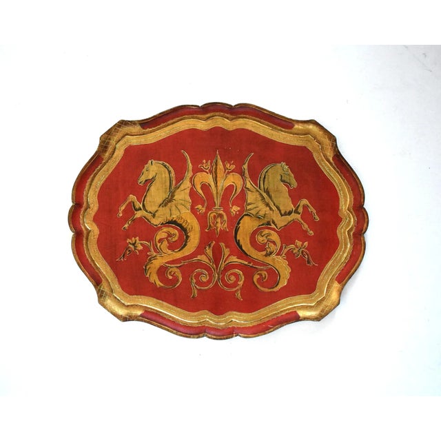 A vintage, mid-century, unusual, very large Florentine tray featuring a design of two mythical seahorses with pointed...