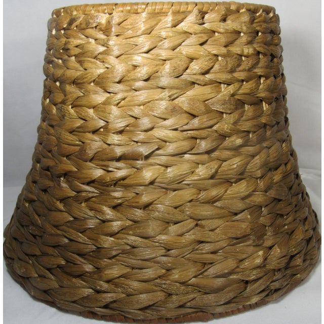 This is a beautiful lamp shade. It is unique, substantial not flimsy, with an oval shape. Empire, oval, natural Hyacinth,...