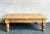 Embrace the warm, inviting essence of farmhouse charm with this vintage knotty pine coffee table, beautifully blending...