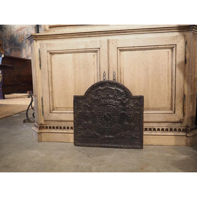 Heraldic cast iron firebacks go back 500 plus years. They would depict a family’s coat of arms at the center, and symbols...