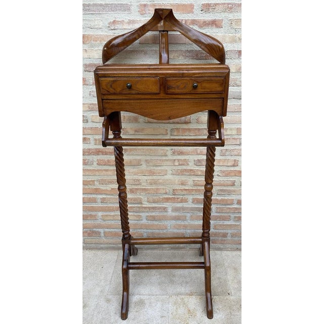 Vintage mid-century gentlemen's valet. Dark walnut and features shelf for cuff links or jewelry and bars for hanging...