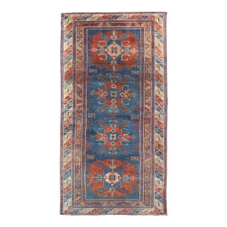 Antique Persian Kurdish Gallery Rug With Blue Field and Bold Geometric Medallion For Sale