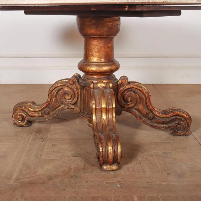 Large 19th C English marble top breakfast table with a lovely worn gilt finish. 1860 This piece is designed in the style...