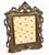 A striking antique Rococo Revival picture frame dating to the early twentieth century, beautifully crafted in heavy cast...