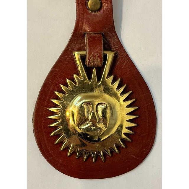 This leather strap was hung from horse saddles/harnesses during parades or other special events. Some of the medallions...