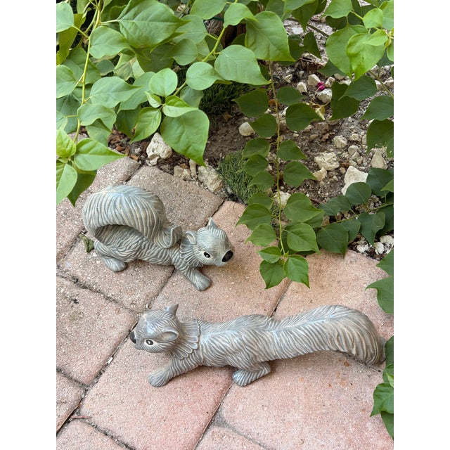 Life size Midcentury ceramic squirrels, perfect for your garden decor.