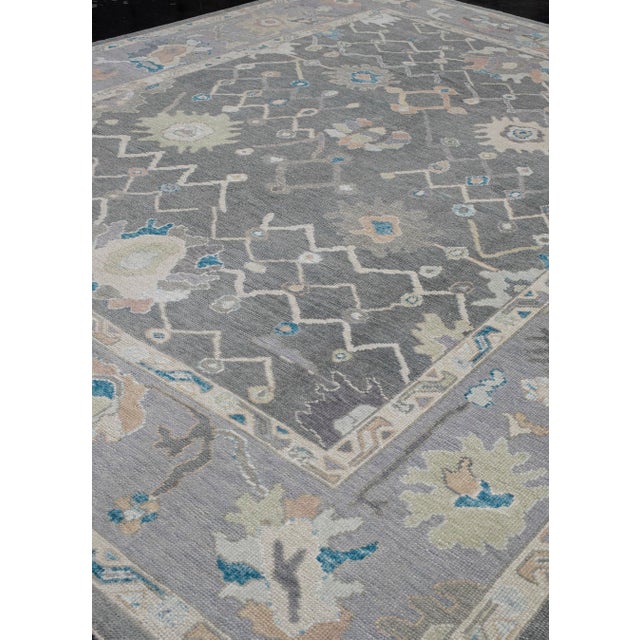 Turkish Oushak Rug Gray, Ivory, and Blue Handwoven Wool Rug 8'11" X 11'8" This handwoven Turkish Oushak rug is a luxurious...