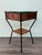 This piece of furniture is a vintage Mid-Century Modern coffee table or nightstand, dating back to the 1950s or 1960s,...