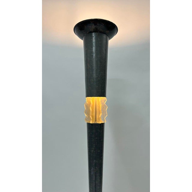 Made of steel with a dark finish, interrupted by a central acrylic glass element. Slender, geometric design with a square...