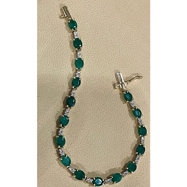 This exceptionally affordable Tennis bracelet has 16 stones of oval Emeralds . Each Emerald is spaced by two diamonds ....