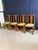 Set of four antique Maplewood dining chairs, stylized in the Arts and Crafts or early Art Deco aesthetic. Constructed from...