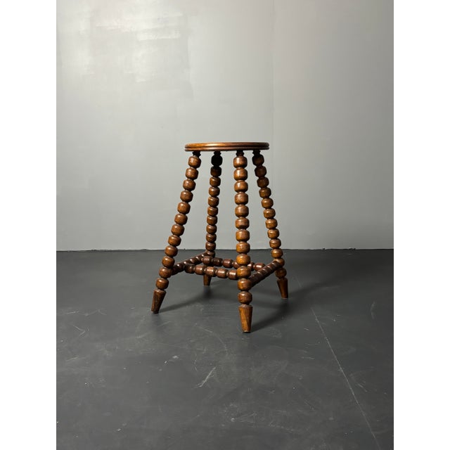 Absolutely stunning and rare wood turned stool in lovely proportions ( 60 cm in height, seat diameter 30 cm ). This stool...