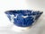 Large vintage Mexican hand thrown and decorated blue and ivory pottery bowl with floral design