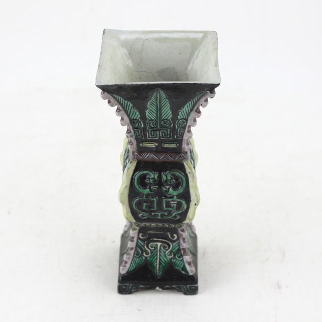 This intricately designed vase showcases an archaistic style inspired by ancient Chinese ritual bronzes. Featuring a...