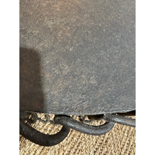 This table is a very sculptural piece of furniture that is made of iron. Is dramatic yet casual. It is very well crafted,...