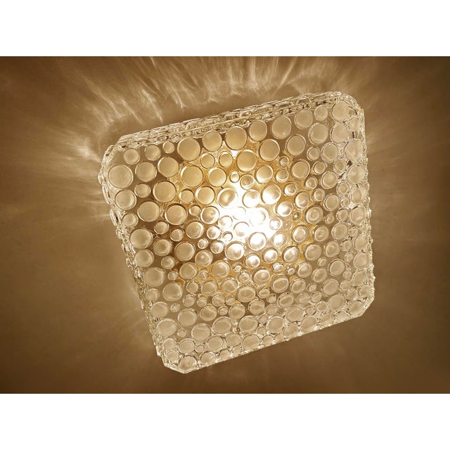 Mid century sconce or flush light featuring a bubble wrap relief glass shade, bronze enameled base very good condition...