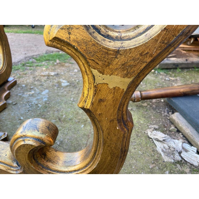 This Vintage Mid Century Rococo Gilt Coffee Table exudes the glamour and luxury typical of the Hollywood Regency era. The...