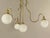 Large Chandelier made of massive brass with 4 opal glass shades. Well suited for high rooms. There are 2 pieces that are...
