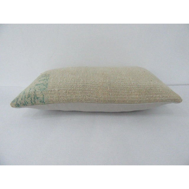 Decorative pillow cover made from a vintage Turkish handknotted rug. Backed with good quality cotton fabric. Pillow...