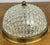 A charming Vintage French ceiling lamp featuring a beautifully textured glass shade mounted within a classic brass...