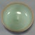 This vintage‑style celadon tea‑bowl features soft pale‑green glaze with natural crackle texture and a delicate...
