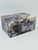 This is a small lidded decorative stone trinket box carved from a natural semi-precious stone, most likely sodalite....