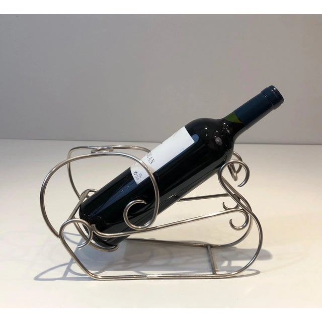 This nice Art Deco wine holder representing a sleigh is made of silver plated. This is a French work, circa 1930.