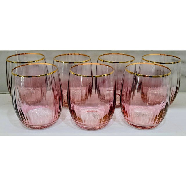 Elevate your bar cart with this complete set of seven Anthropologie “Pink Waterfall” stemless wine glasses, hand painted...
