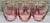 Elevate your bar cart with this complete set of seven Anthropologie “Pink Waterfall” stemless wine glasses, hand painted...