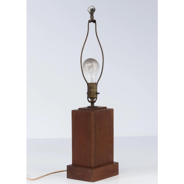 A mid century handmade walnut table lamp. Skyscraper form, primitive, folk and moderne, all at once. The walnut base is 9...