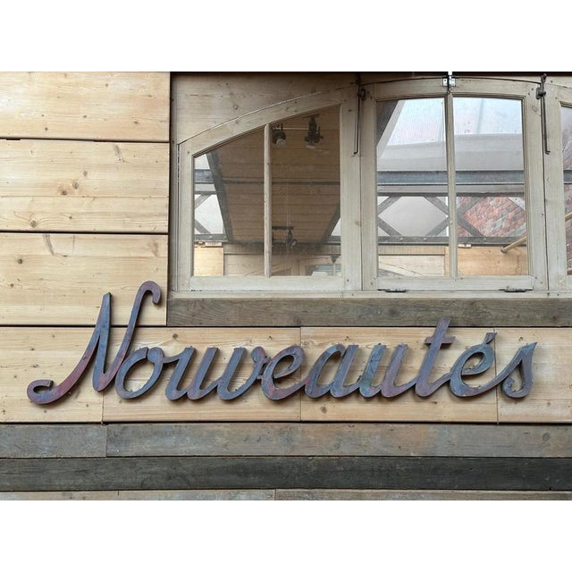 Patinated Nouveautés Sign in Zinc For Sale - Image 9 of 10
