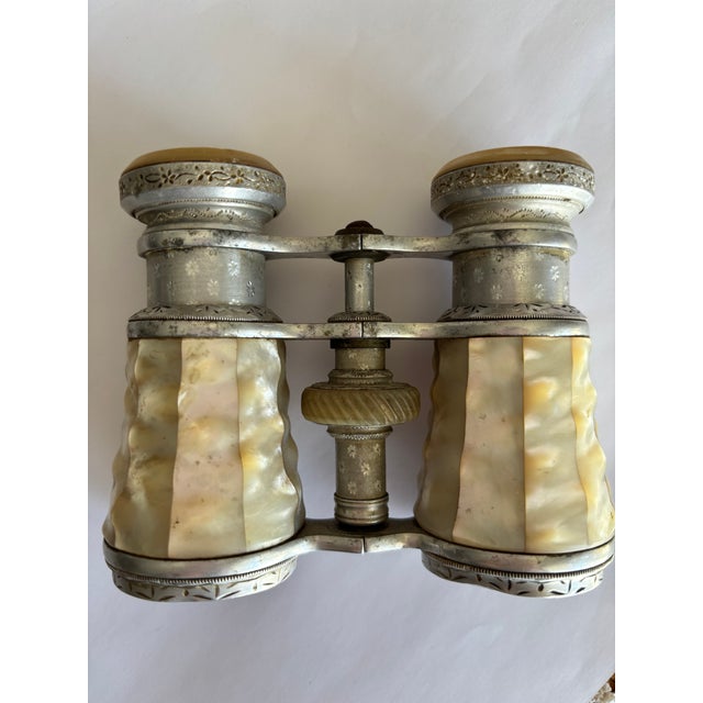 Antique late 19th–early 20th century opera glasses with genuine mother-of-pearl barrels and an engraved silver-plated...