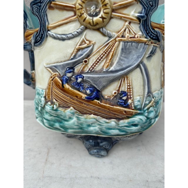19th Century Majolica nautical planter cachepot signed Onnaing, the feets are dolphins and the front is decorated with...
