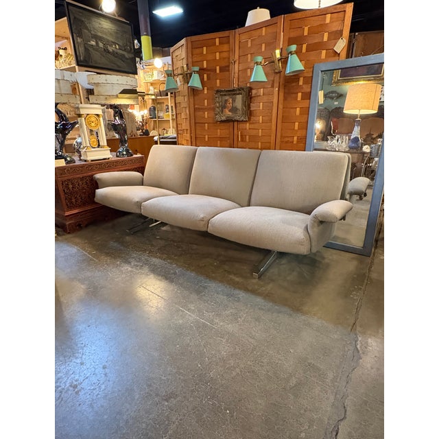 Beautifully made mid century 3 seater sofa by De sede. The fabric is a medium gray and has sturdy heavy steal legs. The...
