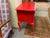 20th century lowboy. Painted red over original finish. Shell design detail, pad feet cabriole legs. Four drawers. Marked...