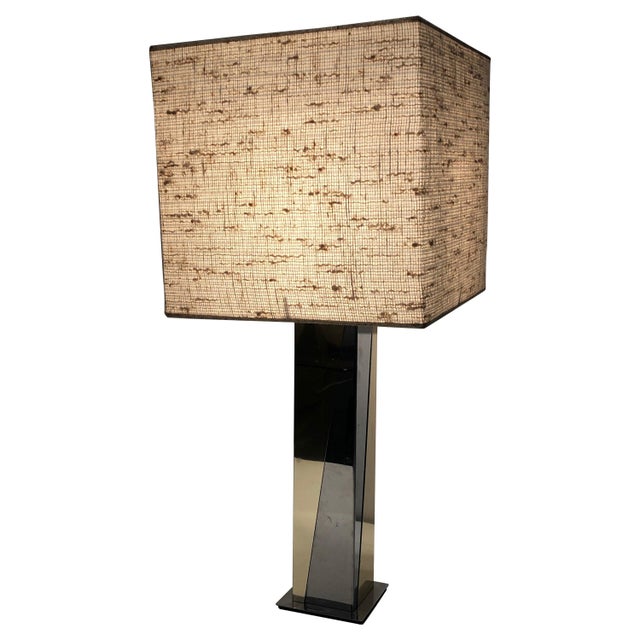 This table lamp is made of chrome and gilt metal. This is a French work. Circa 1970.
