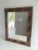 This beautiful mirror is made of a burr walnut marquetry surrounded by two brass frames. This is French work, circa 1960.