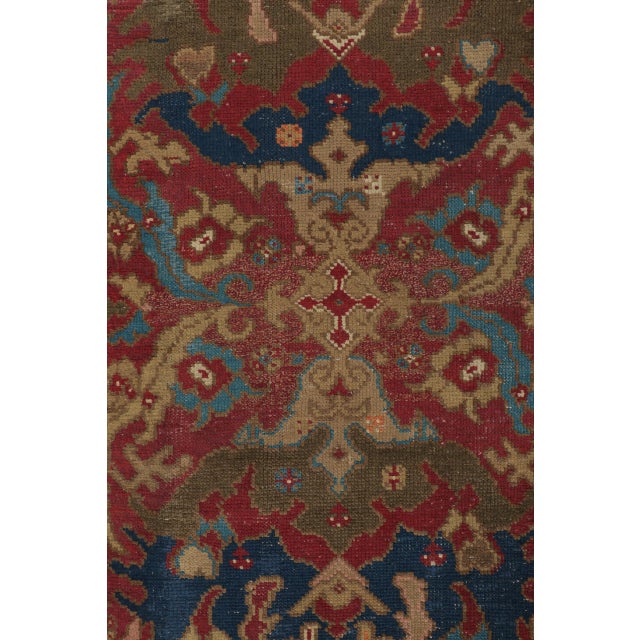 Hand-knotted in wool, this antique English carpet measures 9x12 and dates to circa 1880-1910. The design features a richly...
