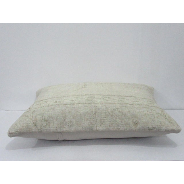 Decorative pillow cover made from a vintage Turkish handknotted rug. Backed with good quality cotton fabric. Pillow...