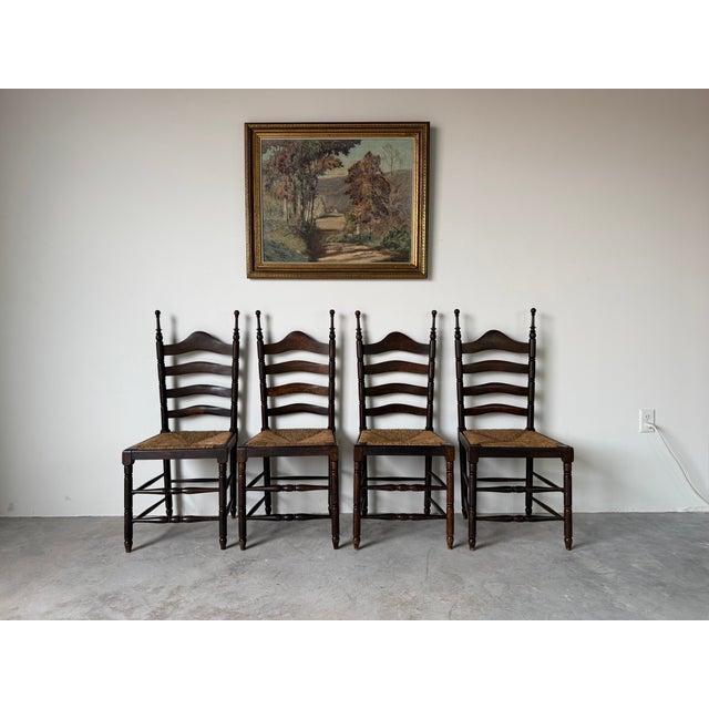 Beautiful vintage Spanish Country dining chairs featuring solid oak construction, classic ladder back design, handwoven...