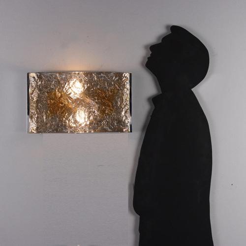 Wall lamp in chromed aluminum and Murano glass. This piece is attributed to the mentioned designer/maker. It has no...