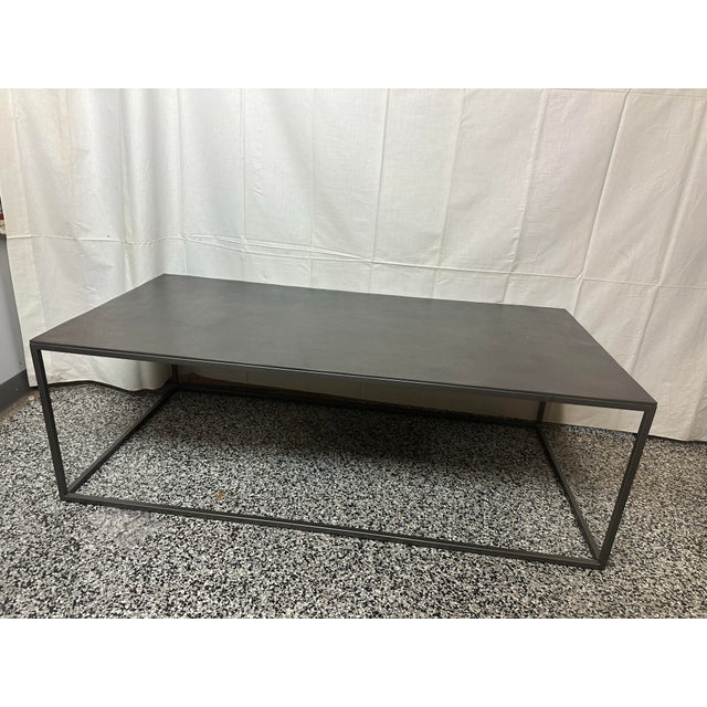 Contemporary Bernhardt “Eaton” coffee table in graphite. This Eaton cocktail table offers a clean minimalist aesthetic and...