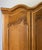 This elegant Vintage French Louis wardrobe showcases graceful French styling with beautifully sculpted decorative panels...